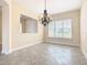 Dining room featuring a chandelier and tile floors at 870 Spinnaker Way, Kissimmee, FL 34746
