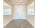 Bright foyer with tile floors and neutral walls at 870 Spinnaker Way, Kissimmee, FL 34746