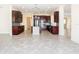 Modern kitchen with dark wood cabinets, granite counters, and stainless steel appliances at 870 Spinnaker Way, Kissimmee, FL 34746