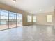Living room with sliders leading to a patio and pool area at 870 Spinnaker Way, Kissimmee, FL 34746