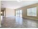 Bright living room with sliding glass doors leading to a patio at 870 Spinnaker Way, Kissimmee, FL 34746