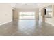 Open living area with view of lake and kitchen at 870 Spinnaker Way, Kissimmee, FL 34746
