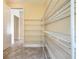 Well-organized pantry with ample wire shelving at 870 Spinnaker Way, Kissimmee, FL 34746
