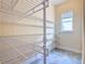Large pantry with wire shelving for storage at 870 Spinnaker Way, Kissimmee, FL 34746