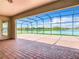 Spacious covered patio with a view of the lake at 870 Spinnaker Way, Kissimmee, FL 34746
