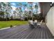 Deck with seating area overlooking a large backyard at 875 Eden Dr, St Cloud, FL 34771