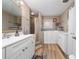 Updated bathroom with walk-in shower, soaking tub, and modern vanity at 875 Eden Dr, St Cloud, FL 34771