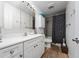 Clean bathroom with white vanity and grey tile shower at 875 Eden Dr, St Cloud, FL 34771