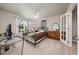 Bedroom with a metal bed frame and glass doors at 875 Eden Dr, St Cloud, FL 34771