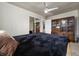 Bedroom with a dark comforter and wood cabinet at 875 Eden Dr, St Cloud, FL 34771