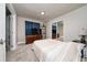 Cozy bedroom with a striped comforter and wood dresser at 875 Eden Dr, St Cloud, FL 34771