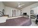 Bedroom with a brown comforter and ceiling fan at 875 Eden Dr, St Cloud, FL 34771