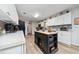 Modern kitchen with white cabinets, stylish island, and new appliances at 875 Eden Dr, St Cloud, FL 34771