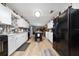 Open concept kitchen with white cabinets and a large island at 875 Eden Dr, St Cloud, FL 34771