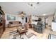 Spacious living room with hardwood floors, comfortable seating, and large windows at 875 Eden Dr, St Cloud, FL 34771