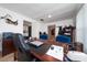 Functional home office featuring a large desk and comfortable chairs at 875 Eden Dr, St Cloud, FL 34771