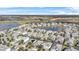 Aerial view of a large neighborhood with houses and lakes at 8870 Backspin Ln, Champions Gate, FL 33896