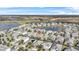 Aerial showing a house in a neighborhood near a golf course at 8870 Backspin Ln, Champions Gate, FL 33896