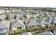 Aerial view of a house in a community with a lake at 8870 Backspin Ln, Champions Gate, FL 33896