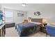 Bright bedroom with a comfortable bed and ample natural light at 8870 Backspin Ln, Champions Gate, FL 33896