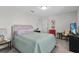Charming bedroom with a comfortable bed and a small seating area at 8870 Backspin Ln, Champions Gate, FL 33896
