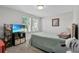 Bedroom with a comfortable bed, TV and plenty of storage at 8870 Backspin Ln, Champions Gate, FL 33896