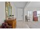 Spacious foyer with antique furniture and large mirror at 8870 Backspin Ln, Champions Gate, FL 33896