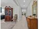 Bright foyer with antique furniture and view to living room at 8870 Backspin Ln, Champions Gate, FL 33896