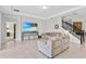 Relaxing living room with gray sofas, a large TV, and ample natural light at 8870 Backspin Ln, Champions Gate, FL 33896