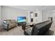 Open loft with seating area and TV at 8870 Backspin Ln, Champions Gate, FL 33896