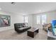 Versatile loft space with seating and windows at 8870 Backspin Ln, Champions Gate, FL 33896