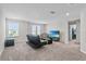 Spacious loft area with a comfortable sofa and TV at 8870 Backspin Ln, Champions Gate, FL 33896