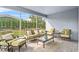 Relaxing screened porch with patio furniture and view of backyard at 8870 Backspin Ln, Champions Gate, FL 33896