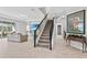 Modern staircase with metal railing at 8870 Backspin Ln, Champions Gate, FL 33896