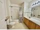 Clean bathroom with a tub, shower, and double vanity at 4006 San Gallo Dr # 108, Kissimmee, FL 34741