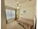 Second bedroom with a double bed and large window at 4006 San Gallo Dr # 108, Kissimmee, FL 34741