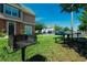 Community grilling area with picnic tables and ample green space at 4006 San Gallo Dr # 108, Kissimmee, FL 34741