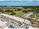 Aerial view of townhouses with parking and surrounding landscape at 7537 Brooklyn Dr, Kissimmee, FL 34747