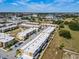 Aerial view of townhouses with parking and surrounding landscape at 7537 Brooklyn Dr, Kissimmee, FL 34747