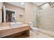 Modern bathroom with a floating vanity and a walk-in shower at 7537 Brooklyn Dr, Kissimmee, FL 34747