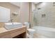 Clean bathroom with a walk-in shower, modern vanity, and toilet at 7537 Brooklyn Dr, Kissimmee, FL 34747