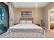 Bright bedroom with a queen-size bed, a bench at the foot of the bed and access to a private patio at 7537 Brooklyn Dr, Kissimmee, FL 34747