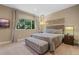 Serene bedroom with plush bedding and large window at 7537 Brooklyn Dr, Kissimmee, FL 34747