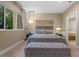 Main bedroom with plush bedding and an ensuite bathroom at 7537 Brooklyn Dr, Kissimmee, FL 34747