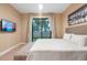 Comfortable bedroom with a queen-size bed and private access to the backyard at 7537 Brooklyn Dr, Kissimmee, FL 34747