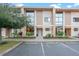 Modern townhome with sleek design and landscape at 7537 Brooklyn Dr, Kissimmee, FL 34747
