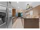 Modern kitchen with stainless steel appliances and island at 7537 Brooklyn Dr, Kissimmee, FL 34747