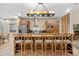 Open concept kitchen with island and breakfast bar at 7537 Brooklyn Dr, Kissimmee, FL 34747