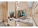 Open living area with a modern fireplace and ample seating, leading to a patio at 7537 Brooklyn Dr, Kissimmee, FL 34747