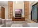 Living room with modern fireplace and TV at 7537 Brooklyn Dr, Kissimmee, FL 34747